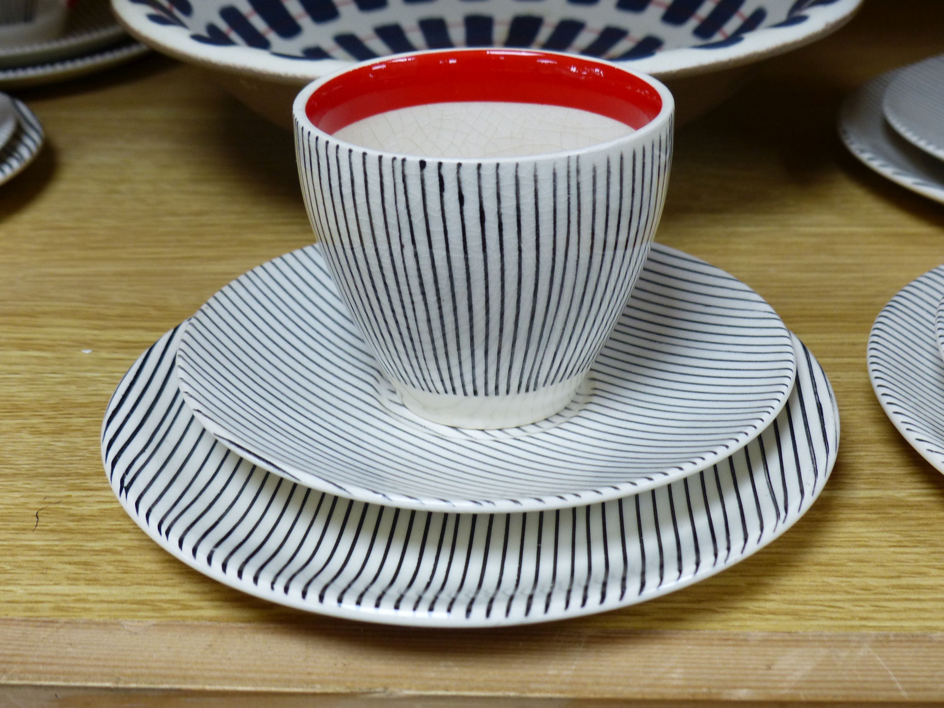 A Poole pottery dish and a set of six Broadhurst Harlem cup, saucers and plates